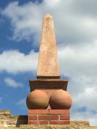 Low angle view of sculpture against sky