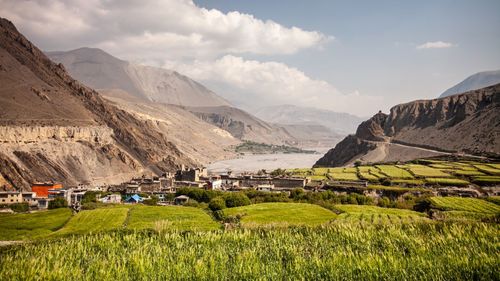 Scenic view of landscape and mountains against sky