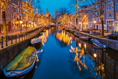 Reflection of illuminated buildings in canal at night