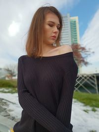 Beautiful woman while standing in city