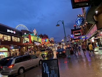 Illuminated city street at night