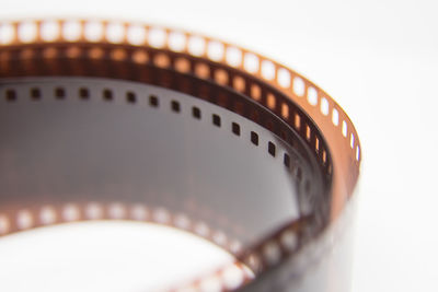 Close-up of film reel against gray background