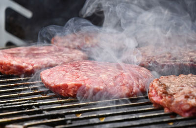 Close-up of meat on barbecue grill