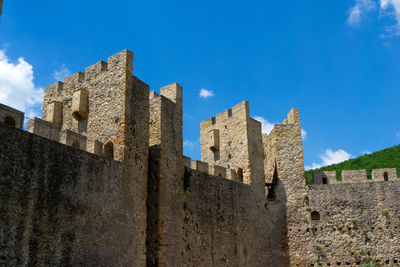 Low angle view of buildings against blue sky