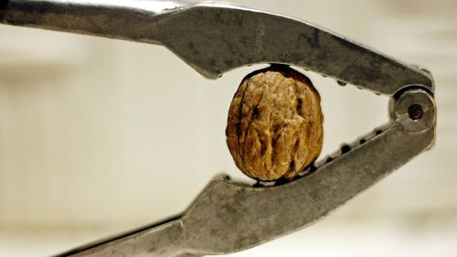 Close-up of rusty metal on table