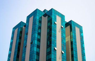 Low angle view of building against clear sky in city