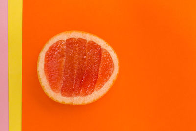 Close-up of orange over white background