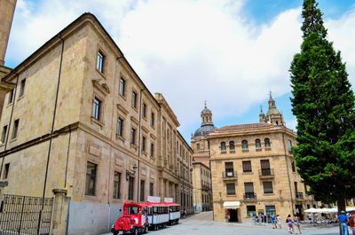 View of buildings against cloudy sky