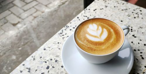 Close-up of cappuccino on table