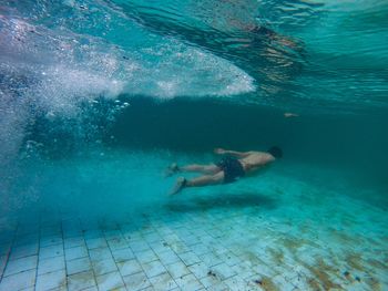 Man swimming in pool