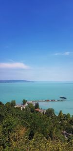 Scenic view of sea against blue sky