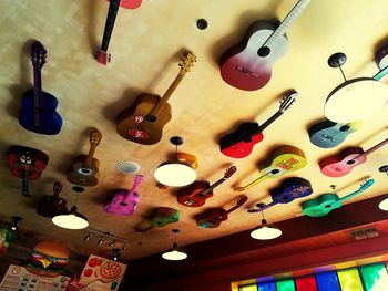 Low angle view of illuminated lanterns hanging in store