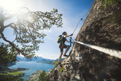 Low angle view of rock climber