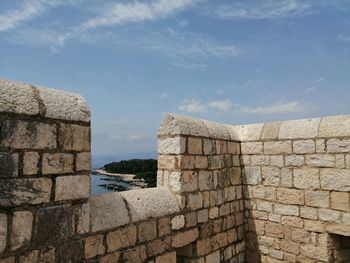 Old stone wall against sky