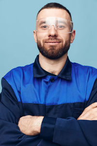 Portrait of man standing against clear sky