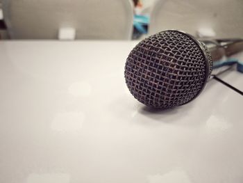 Close-up of microphone on table