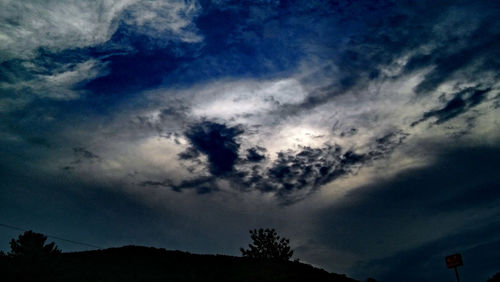 Low angle view of silhouette mountain against sky