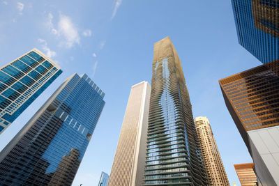 Low angle view of modern buildings against sky in city