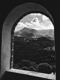 Scenic view of mountains against cloudy sky