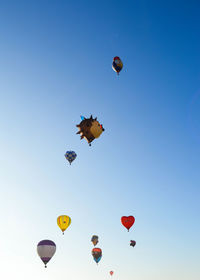 Low angle view of hot air balloons against sky