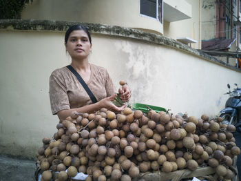 Portrait of woman holding food