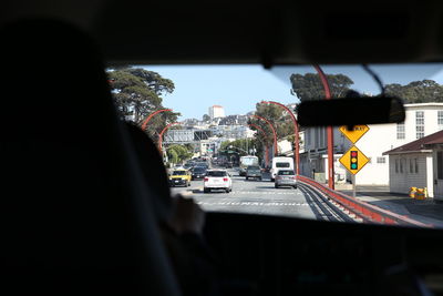 Buildings seen through car windshield