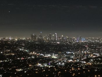 Illuminated buildings in city at night