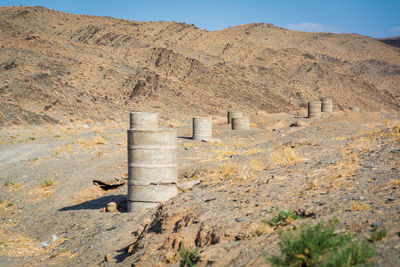 Stacked concrete pipes on top of water well in different places in desert