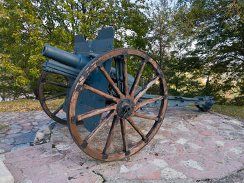 Old rusty wheel on field