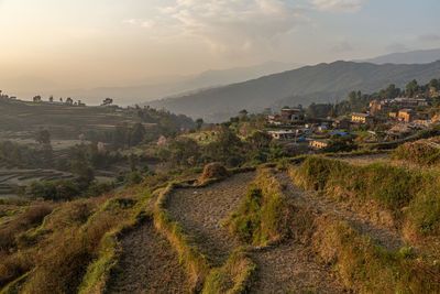 Scenic view of landscape and mountains against sky