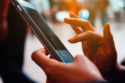 Close-up of woman using mobile phone