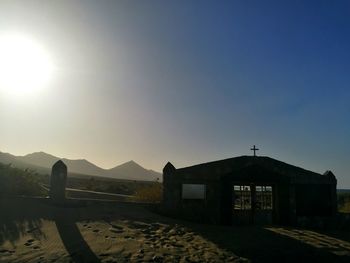 Built structure against sky at sunset