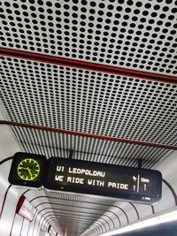 Low angle view of illuminated text on ceiling