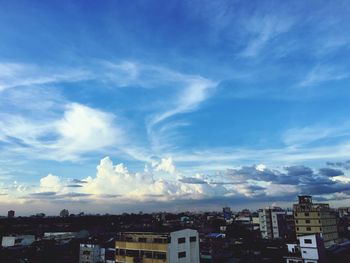 Cityscape against blue sky