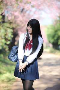 Young woman wearing hat standing outdoors