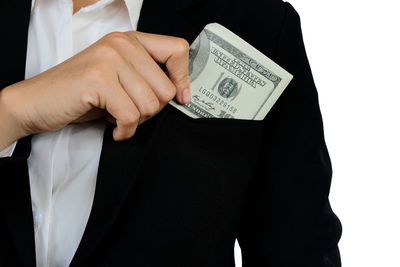 Midsection of woman holding hands against white background