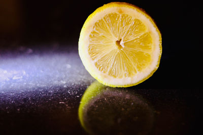 Close-up of lemon slice on table