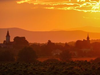 Landscape against orange sky