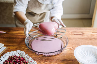 Mousse cake. mirror glaze cake. process of making heart shape mousse cake with pink mirror glaze