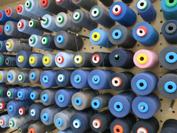 Full frame shot of multi colored thread in spools