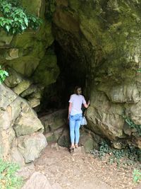 Full length of woman standing on rock