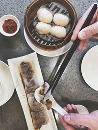 High angle view of person preparing food on table