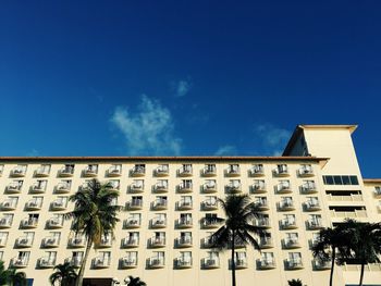 Low angle view of building against blue sky