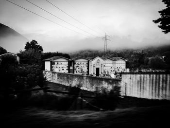 Houses in town against sky