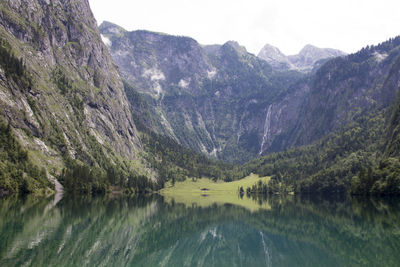 Scenic view of lake and mountains against sky