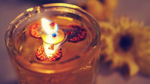 Close-up of illuminated tea light candle