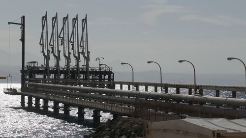 Pier over sea against sky