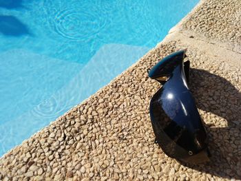 High angle view of sunglasses on swimming pool