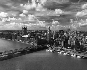 View of cityscape against cloudy sky