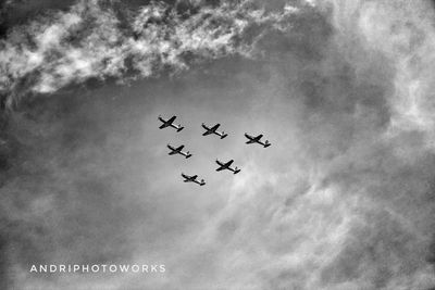 Low angle view of airplane flying in sky